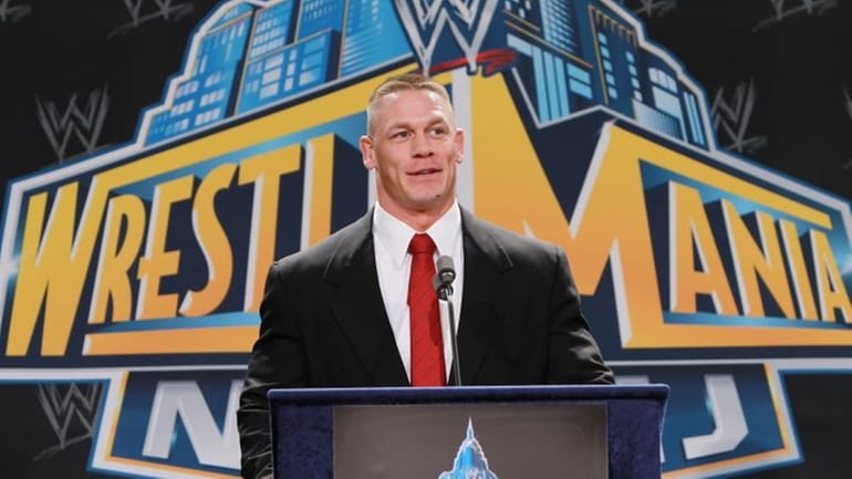 World Wrestling Entertainment personality John Cena speaks at a news...