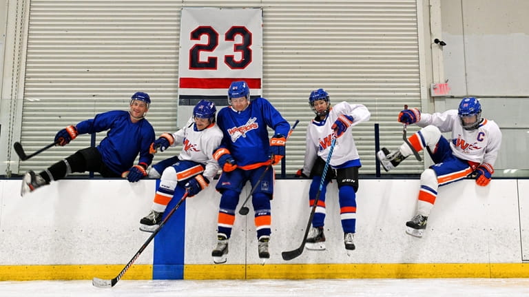 Members of the LI Warriors Hockey team (pictured left to...