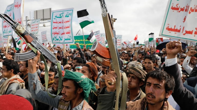 Houthi supporters attend a rally in the Gaza Strip, in...