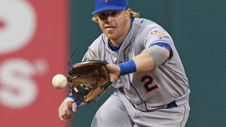 Second baseman Justin Turner fields a ground ball during a...