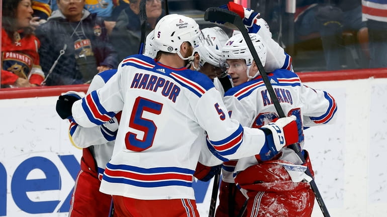 The Rangers celebrate after their goal against the Panthers during...