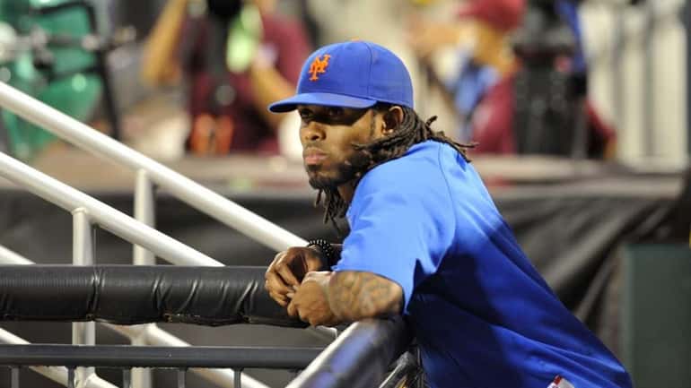Jose Reyes, on the DL, watches a game from the...