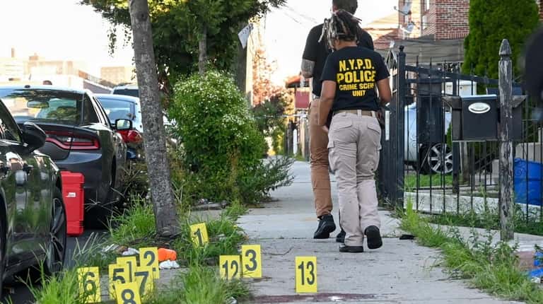 NYPD crime scene investigators probe scene of fatal shooting on...