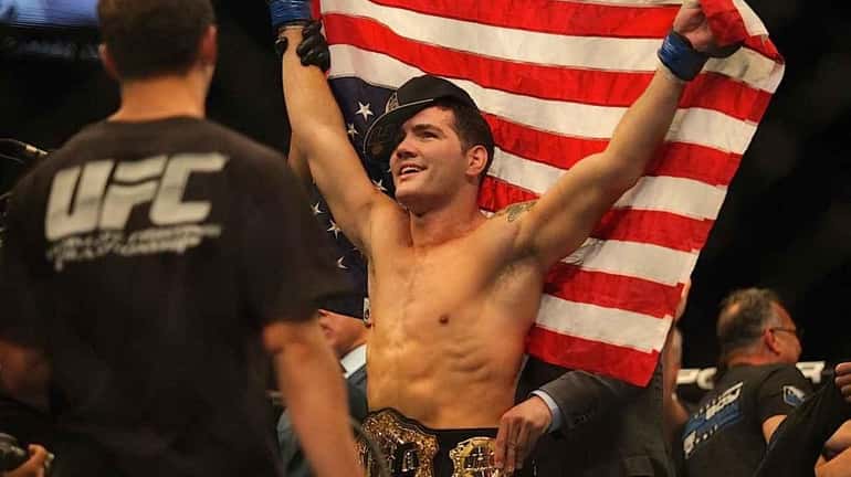 Chris Weidman celebrates after defeating Anderson Silva. (July 6, 2013)