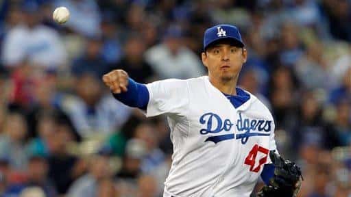 Los Angeles Dodgers third baseman Luis Cruz throws out Atlanta...