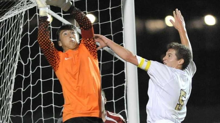 Chaminade's goalie Ricky Berotti (1, left) keeps his cool an...