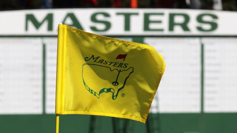 FILE - The Masters golf pin flag on the 9th...