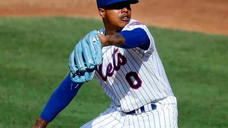 Marcus Stroman #0 of the New York Mets pitches during...