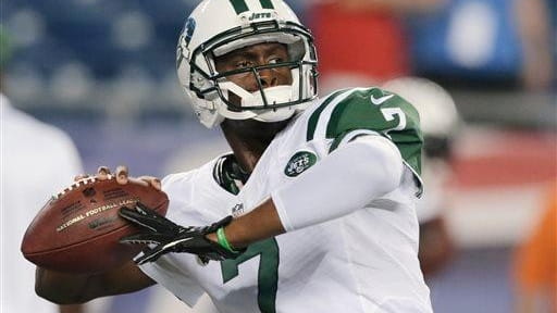 Geno Smith throws a pass as he warms up for...