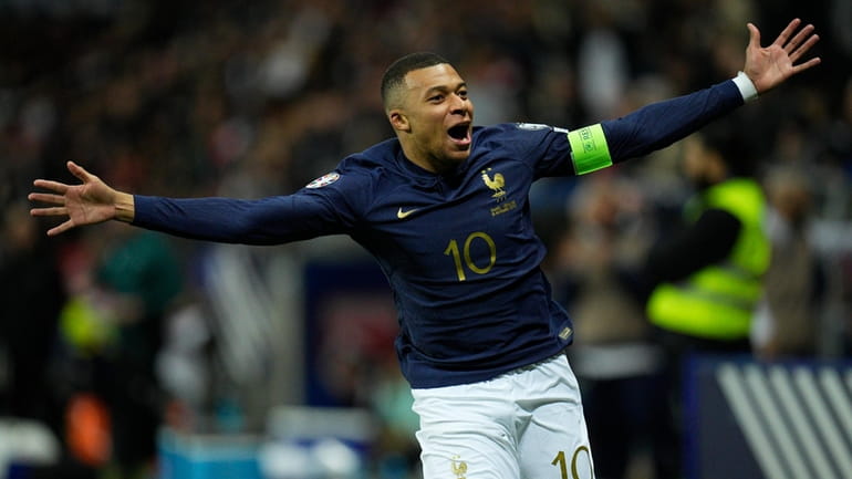 France's Kylian Mbappe celebrates after a goal during the Euro...