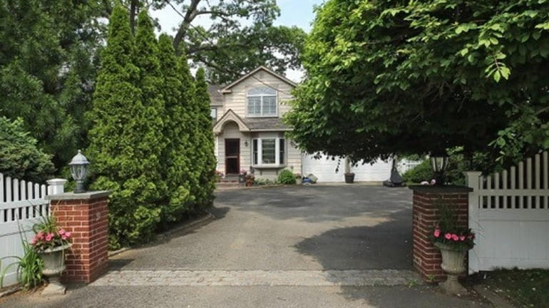 This Colonial in Rockville Centre, priced at $1.199 million, was...