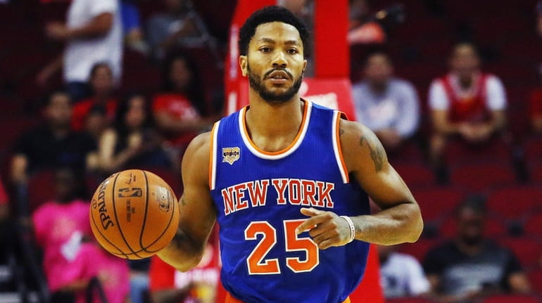 Derrick Rose of the New York Knicks takes the basketball...