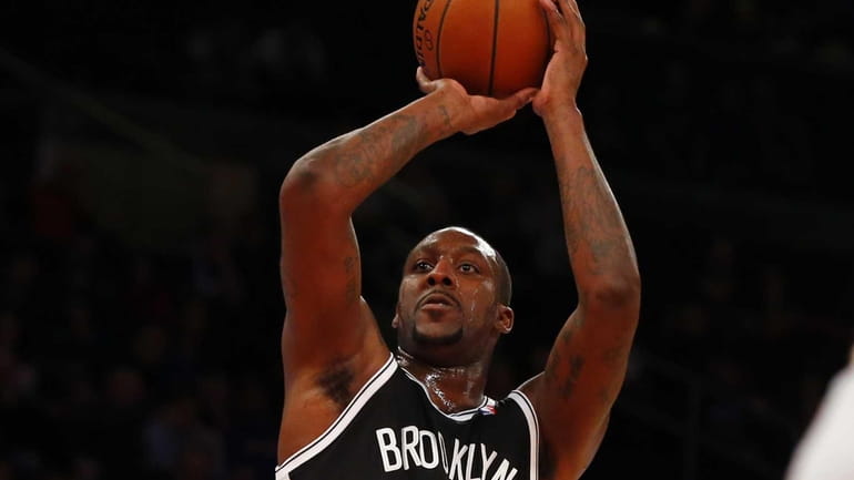 Andray Blatche puts up a shot during a game against...