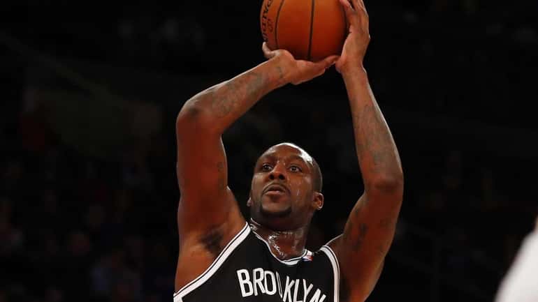Andray Blatche puts up a shot during a game against...