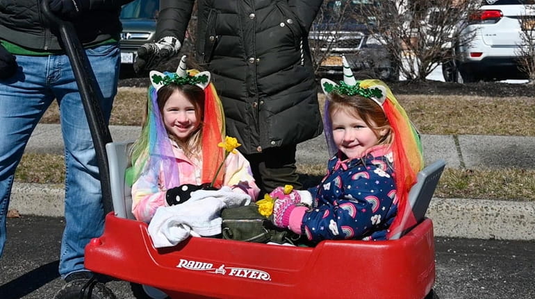 Callie Steiger, 5, left, and her sister McKenzie, 4, of...