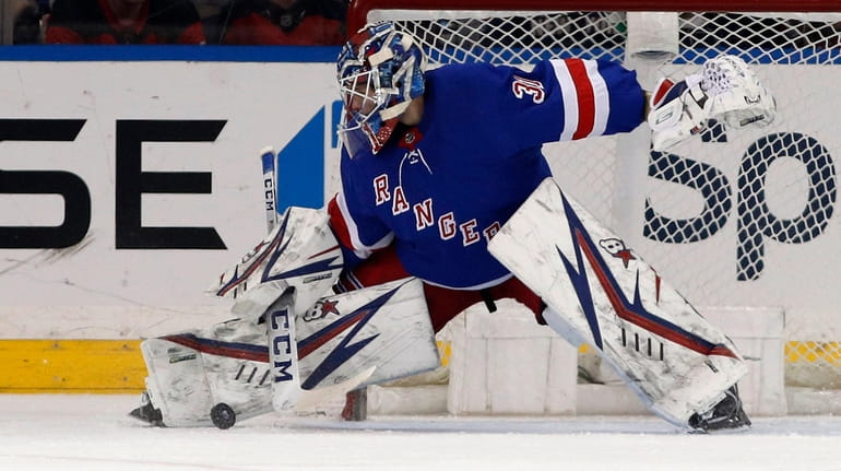 Igor Shesterkin of the Rangers makes a save during the first period...