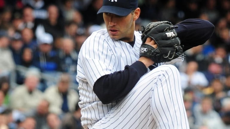 New York Yankees pitcher Andy Pettitte throws on the mound...