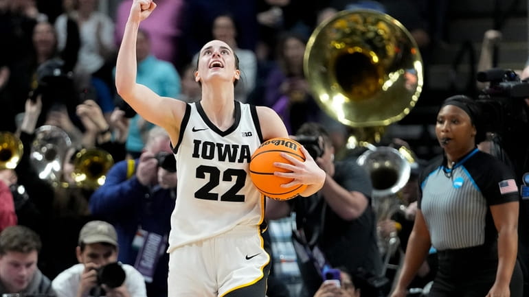 Iowa guard Caitlin Clark (22) celebrates after defeating LSU in...