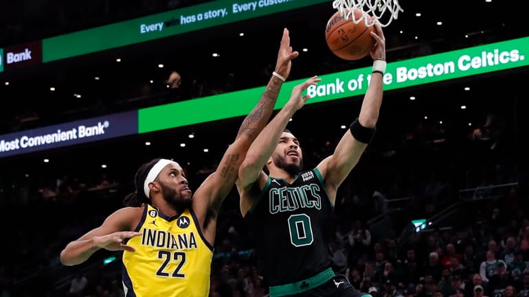Boston Celtics' Jayson Tatum (0) shoots against Indiana Pacers' Isaiah...