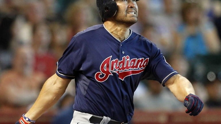 Johnny Damon #33 of the Cleveland Indians reacts as he...