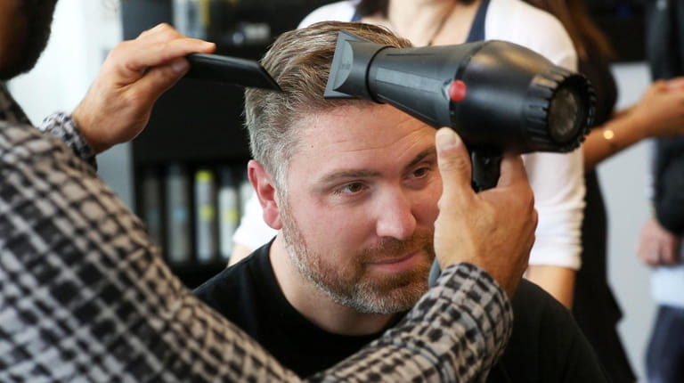Keith Burns mid-makeover at Sorell Salon in Roslyn.