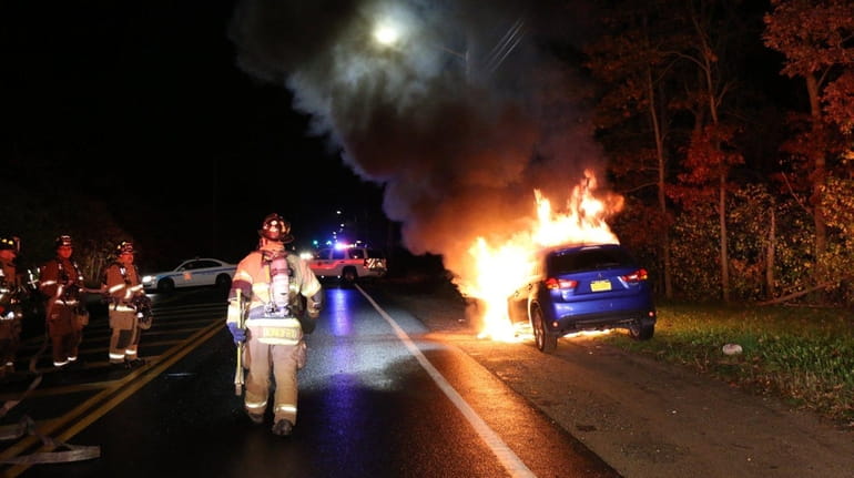 Firefighters respond to a vehicle fire early Friday, Nov. 10,...