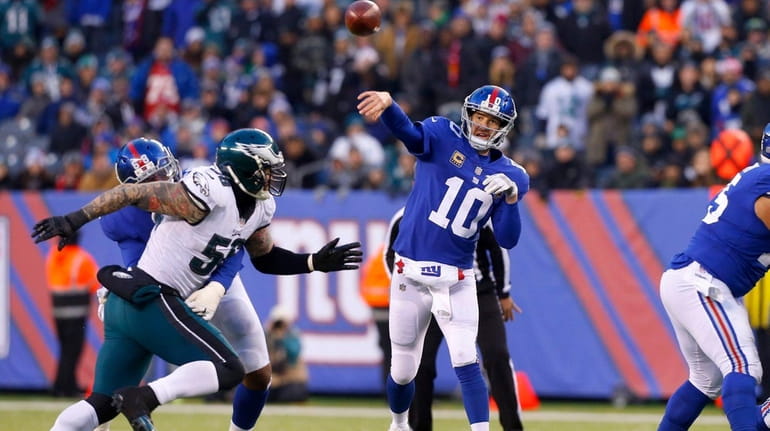 Eli Manning of the New York Giants throws a pass...