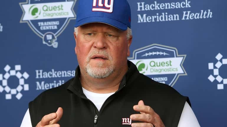 Giants defensive coordinator Don "Wink" Martindale talks to media during...