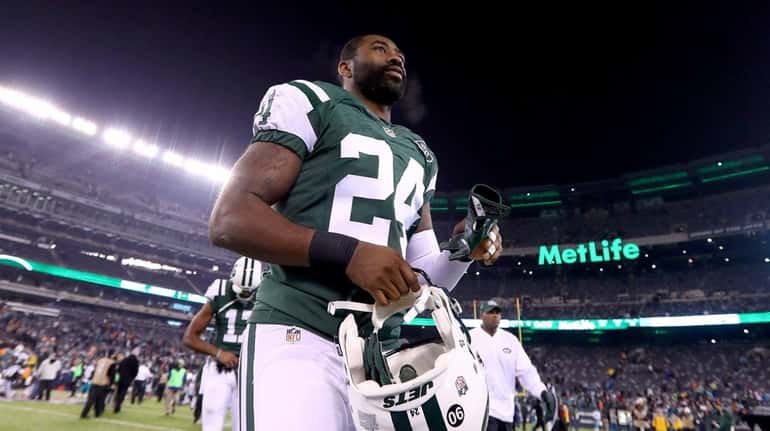 Darrelle Revis walks off the field after Jets' 34-13 loss...
