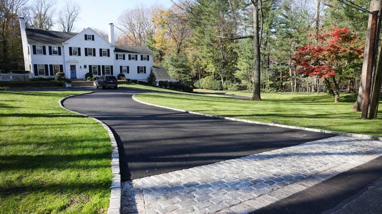 Before Jen Tytel and Phil Wolk added a 100-foot-long asphalt driveway...