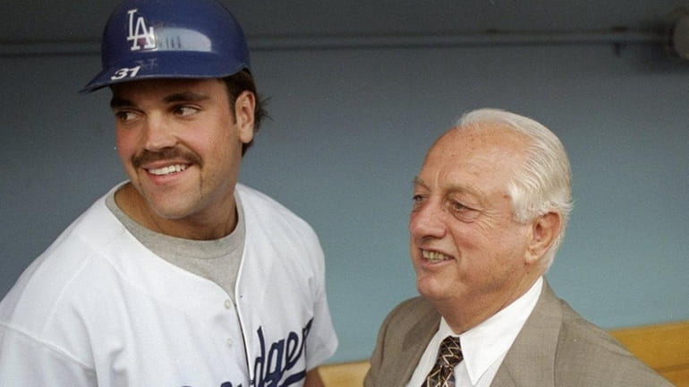Former manager Tommy Lasorda and catcher Mike Piazza of the...