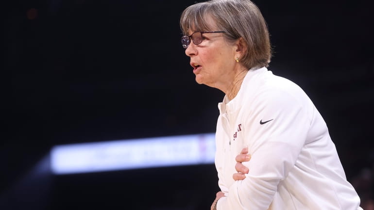 Stanford head coach Tara VanDerveer talks to her team during...