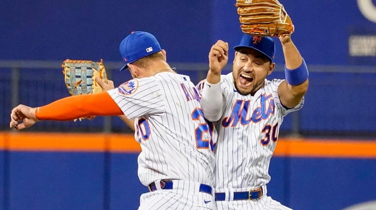 The Mets' Michael Conforto and Pete Alonso celebrate after defeating Atlanta...