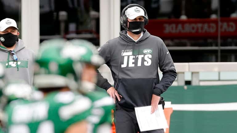 Head coach Adam Gase of the Jets looks on in...