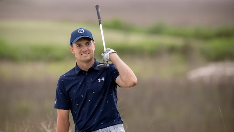FILE - Jordan Spieth celebrates from the front bunker after...