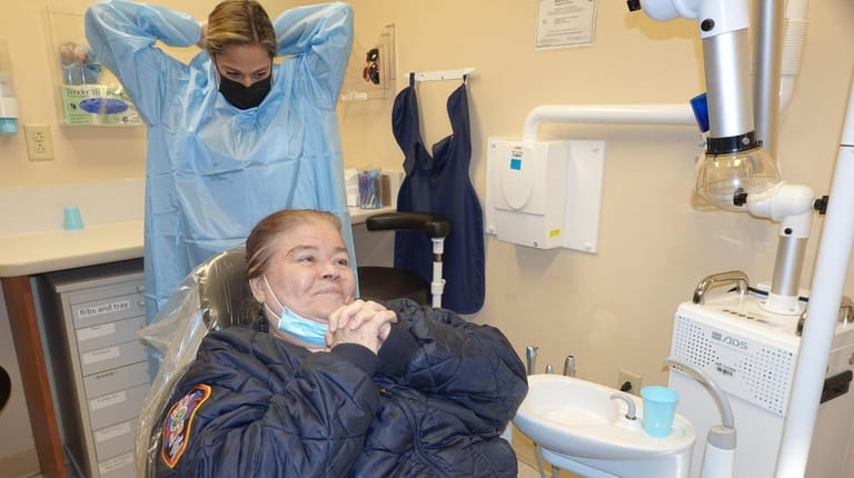 Bronx resident Doris Feliciano is ready for her dentist examination...