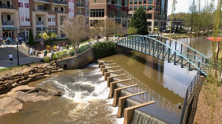 Falls Park on the Reedy River is the centerpiece of...