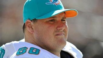 Miami Dolphins guard Richie Incognito (68) looks on during a...