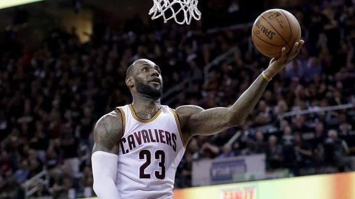 LeBron James #23 of the Cleveland Cavaliers goes up for...
