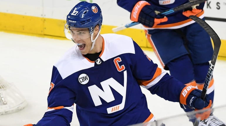 Islanders left wing Anders Lee reacts after he scores against...