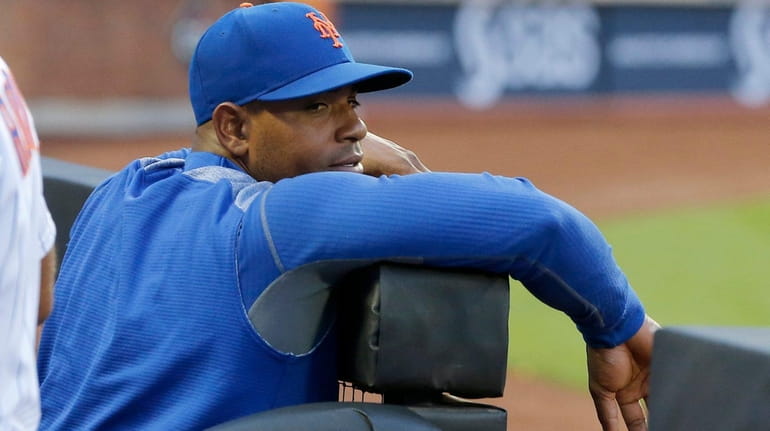 Mets outfielder Yoenis Cespedes looks on from the dugout during...