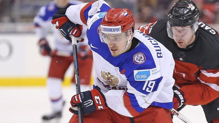 Pavel Buchnevich of Team Russia tries to break clear of...