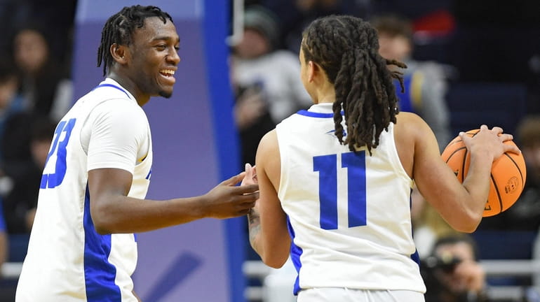 Tyler Thomas of Hofstra, left, and Jaquan Carlos celebrate as the...