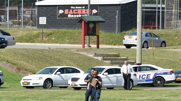 Suffolk police in August 2017 on the athletic field at Sachem...