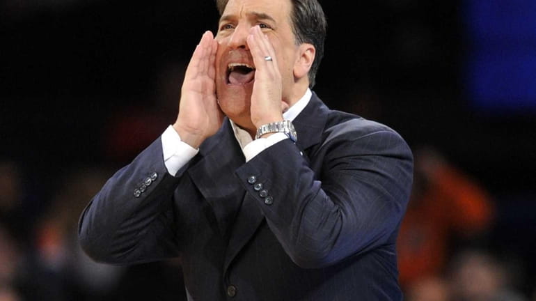 St. John's coach Steve Lavin calls out to his players...