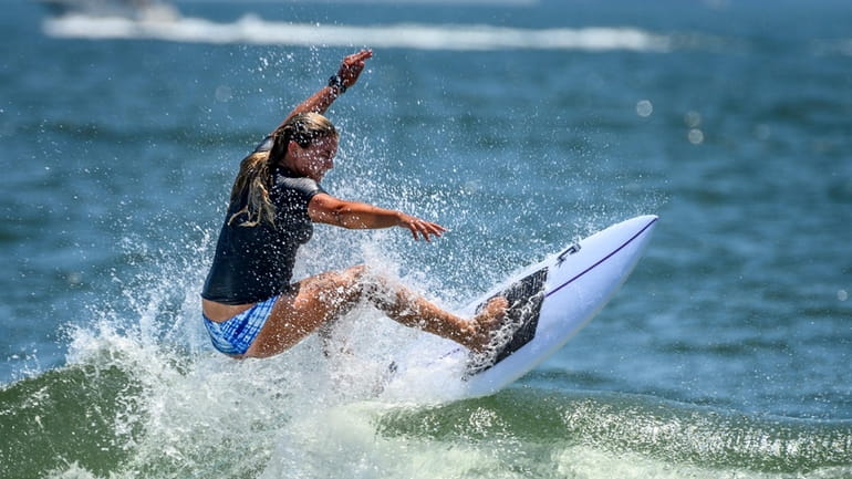 Symca Sachs surfs during a competition in Long Beach.