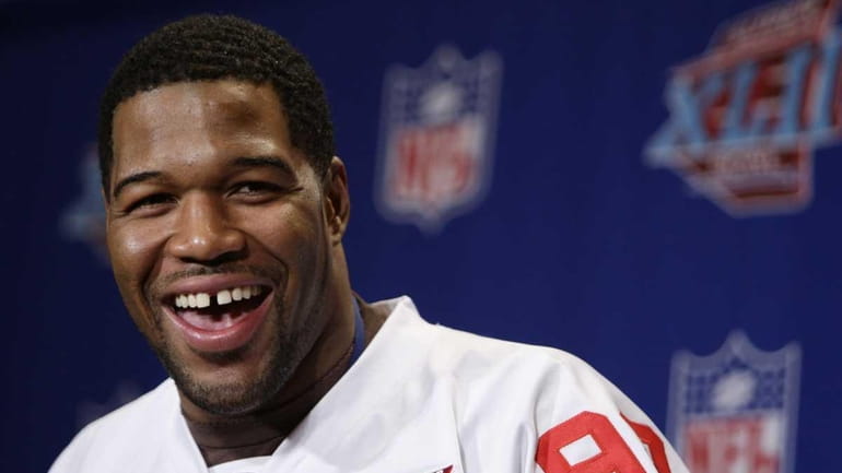 Ex-Giant Michael Strahan speaks during a press conference.