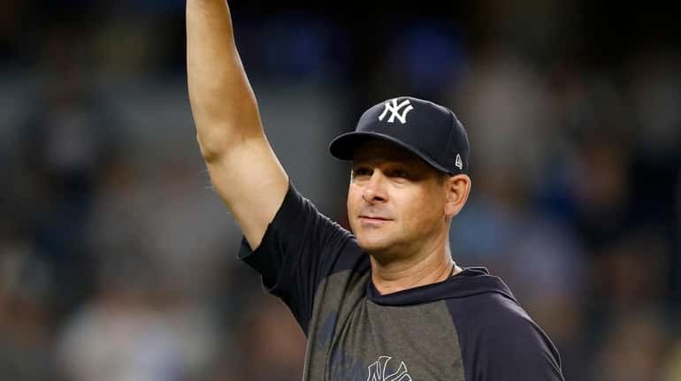 Manager Aaron Boone #17 of the Yankees gestures to the...
