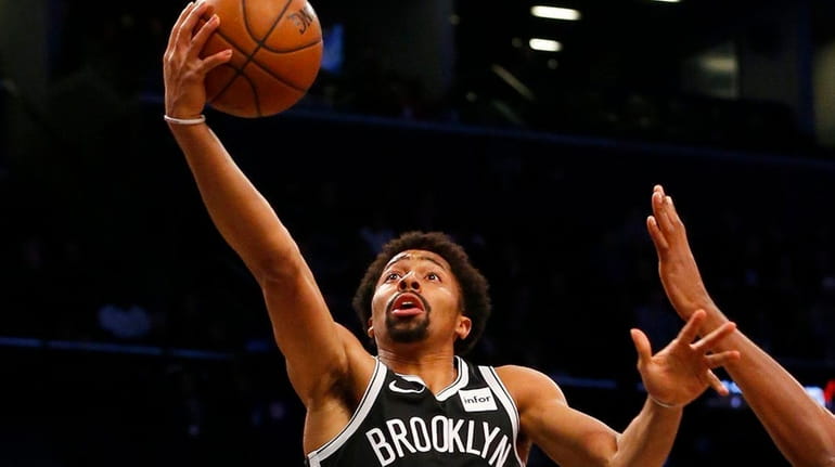 Spencer Dinwiddie of the Nets goes to the hoop for...
