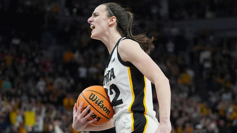 Iowa guard Caitlin Clark celebrates as time expires during the...
